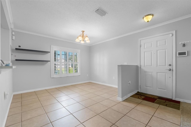 interior space featuring a textured ceiling, a notable chandelier, and crown molding