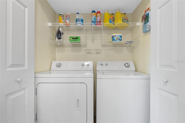 washroom with washer and dryer