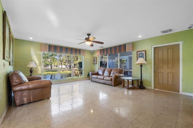 living room featuring ceiling fan