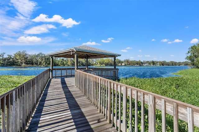 dock area with a gazebo and a water view