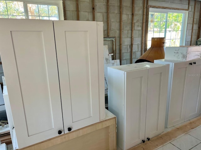 clothes washing area featuring a healthy amount of sunlight