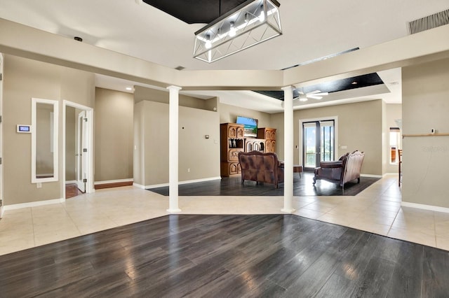 interior space featuring ceiling fan, french doors, and light hardwood / wood-style flooring