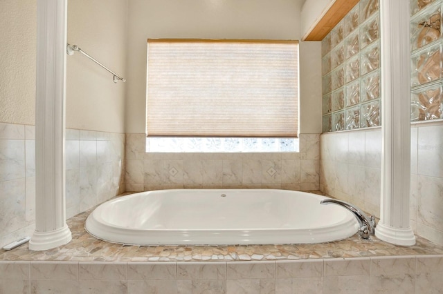 bathroom with tiled tub