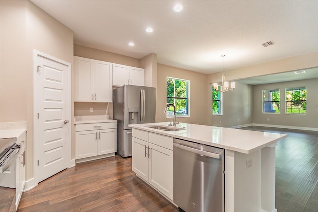 kitchen featuring plenty of natural light, sink, white cabinetry, and stainless steel appliances