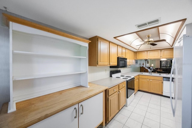 kitchen with ceiling fan, sink, white appliances, light brown cabinetry, and light tile patterned floors