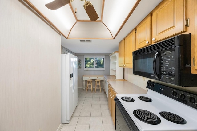 kitchen with light tile patterned floors, white appliances, ceiling fan, and light brown cabinetry