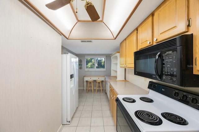9433 Harbor Greens Way Unit 403, Seminole, FL 33776 - kitchen featuring white appliances, light countertops, light tile patterned floors, ceiling fan, and light brown cabinets