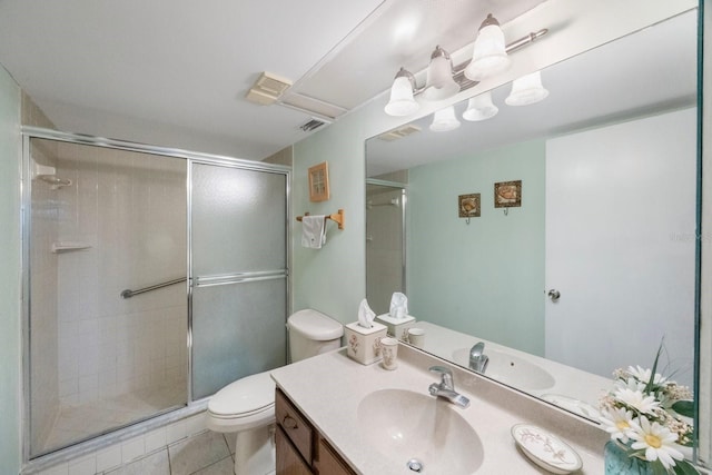 bathroom featuring tile patterned flooring, vanity, toilet, and an enclosed shower