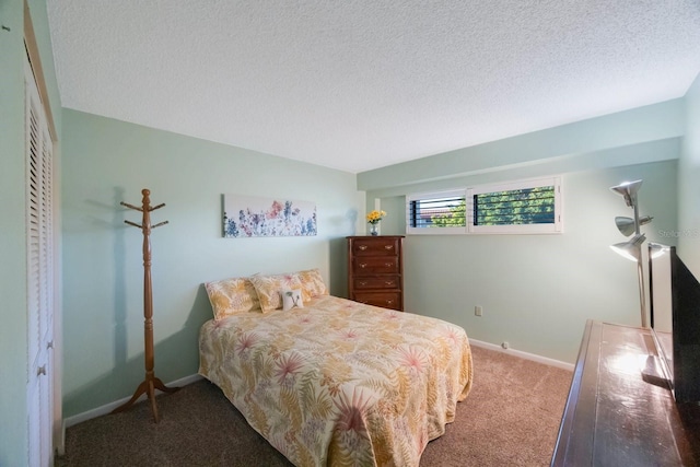 9433 Harbor Greens Way Unit 403, Seminole, FL 33776 - carpeted bedroom with a textured ceiling and baseboards