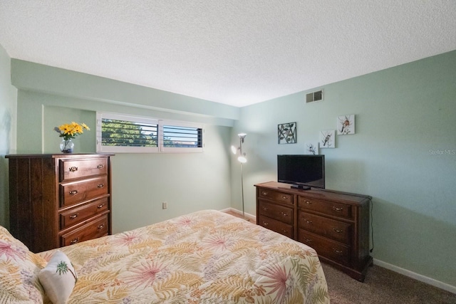 9433 Harbor Greens Way Unit 403, Seminole, FL 33776 - carpeted bedroom with baseboards and a textured ceiling