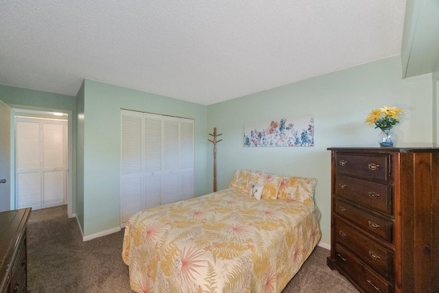 carpeted bedroom with a closet and a textured ceiling