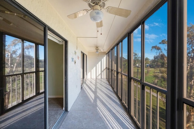 9433 Harbor Greens Way Unit 403, Seminole, FL 33776 - unfurnished sunroom with a ceiling fan