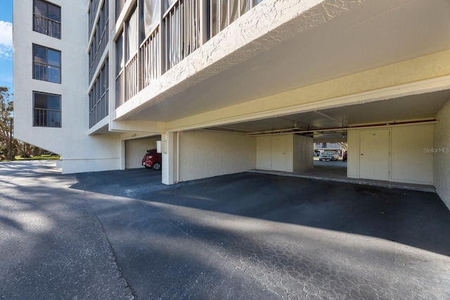9433 Harbor Greens Way Unit 403, Seminole, FL 33776 - garage featuring covered parking