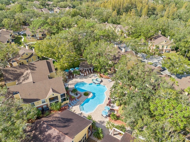 8722 Mallard Reserve Dr Unit 204, Tampa, FL 33614 - aerial perspective of suburban area featuring a pool area and a heavily wooded area