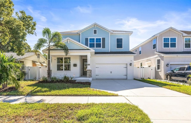 view of front of house featuring a front yard and a garage