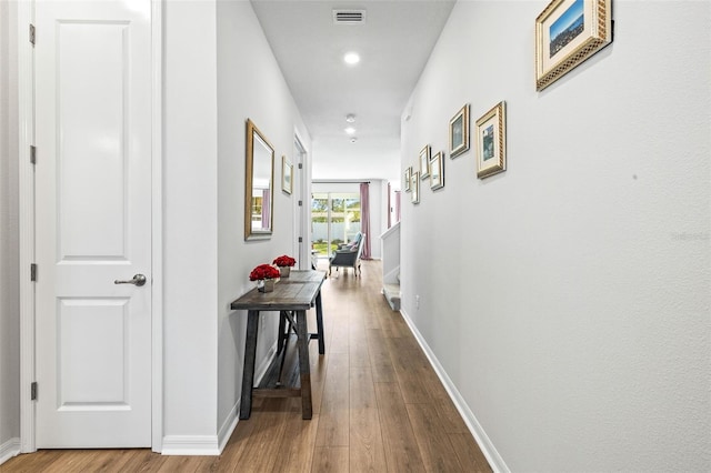 corridor featuring hardwood / wood-style flooring