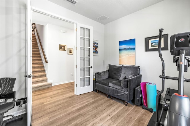 sitting room featuring light hardwood / wood-style floors and french doors