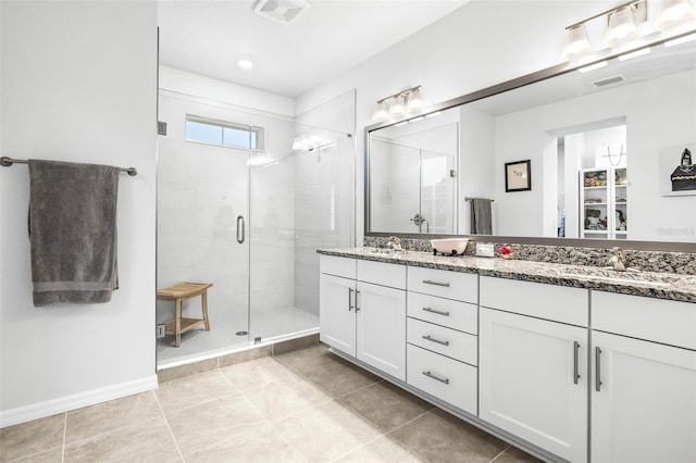 bathroom with vanity, tile patterned floors, and walk in shower