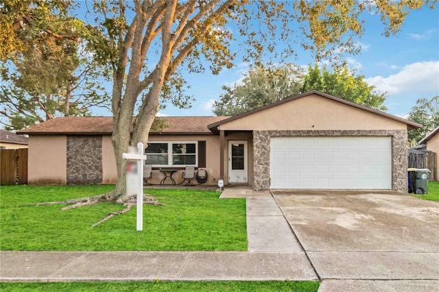 ranch-style house featuring a front yard and a garage