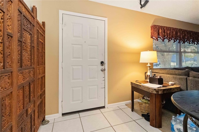 foyer entrance featuring light tile patterned flooring