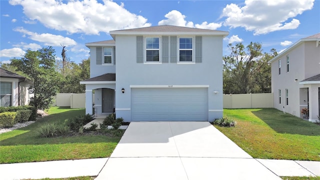 view of front of home featuring a garage and a front yard