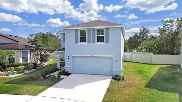 view of front of home with a garage and a front lawn