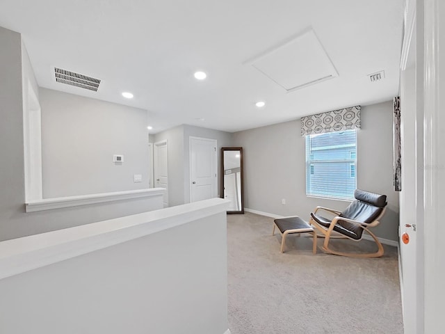 unfurnished room featuring light colored carpet