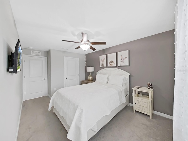 carpeted bedroom with ceiling fan