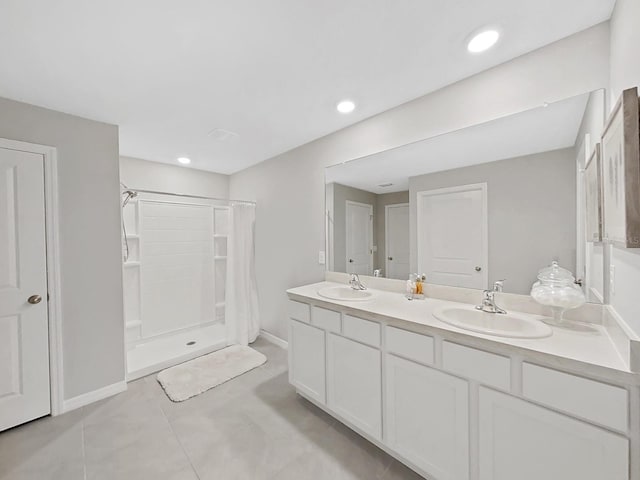 bathroom featuring tile patterned floors, a shower with curtain, and vanity