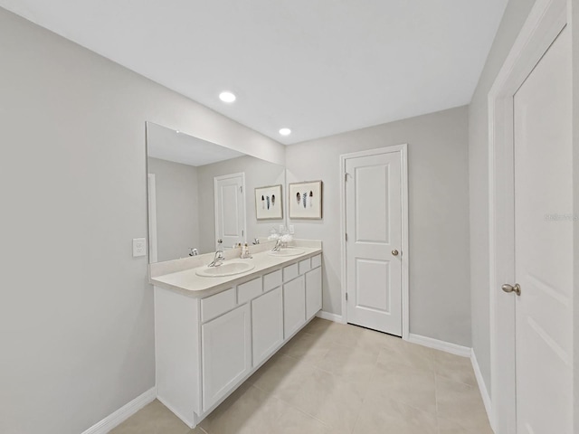 bathroom featuring tile patterned flooring and vanity