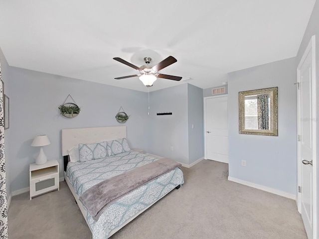 carpeted bedroom featuring ceiling fan