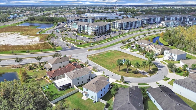 birds eye view of property with a water view