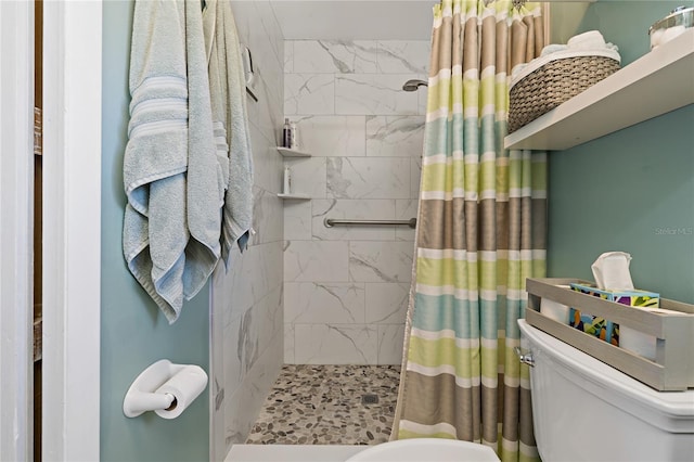 bathroom with a shower with shower curtain and toilet