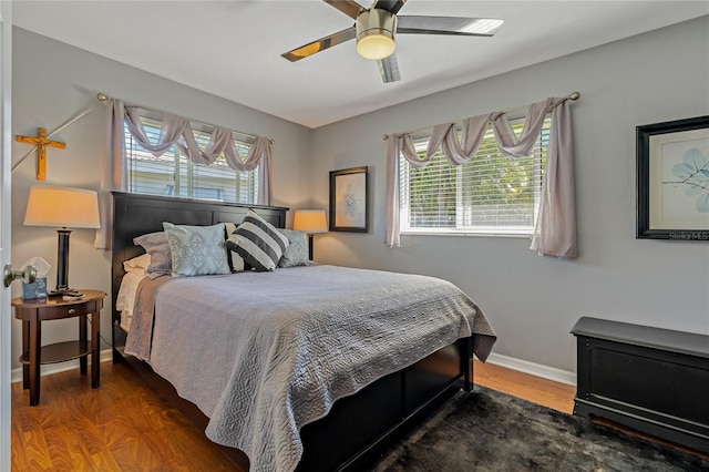 bedroom featuring hardwood / wood-style flooring and ceiling fan