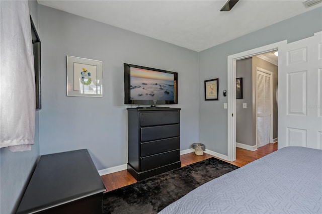 bedroom featuring ceiling fan and hardwood / wood-style floors