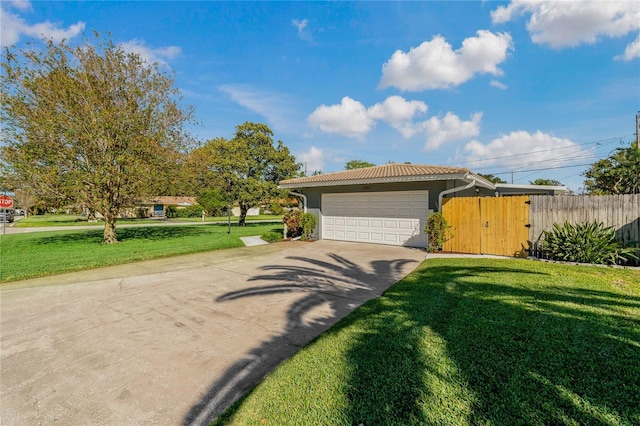 view of front facade with a garage and a front lawn