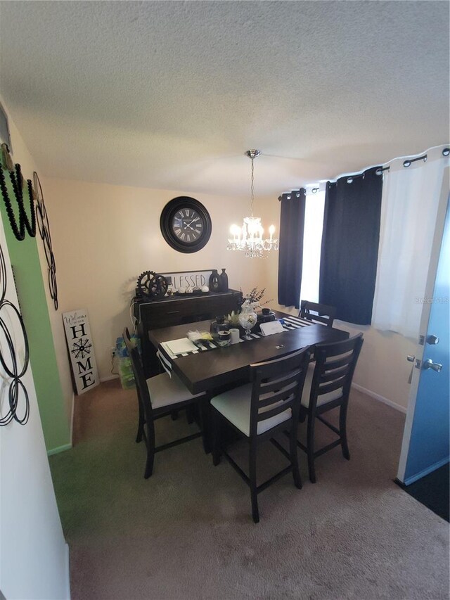 4880 Locust St NE Unit 234, Saint Petersburg, FL 33703 - carpeted dining room featuring a chandelier and a textured ceiling