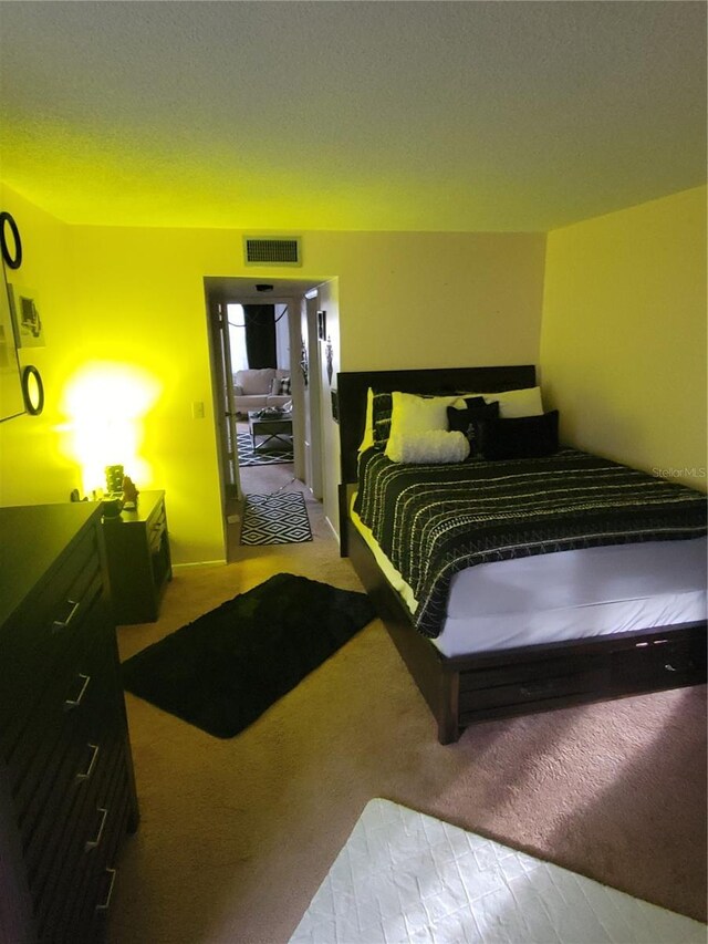 4880 Locust St NE Unit 234, Saint Petersburg, FL 33703 - bedroom with carpet flooring