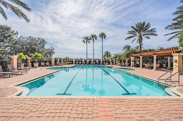 view of pool featuring a pergola and a patio