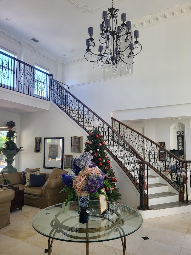 interior space with a high ceiling and a notable chandelier