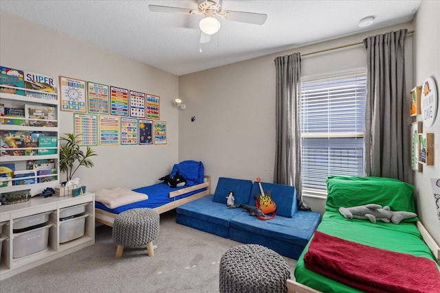 carpeted bedroom with ceiling fan