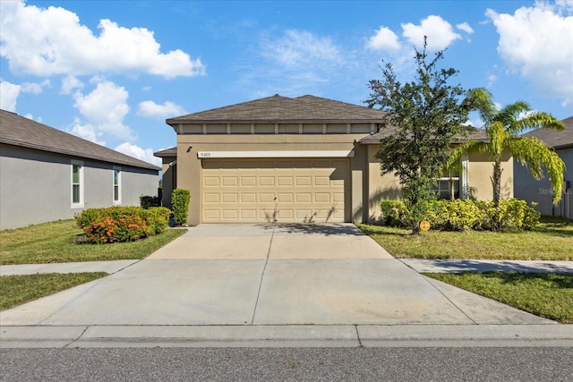 view of front facade featuring a front yard and a garage