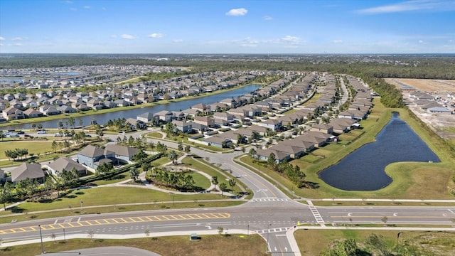 birds eye view of property featuring a water view