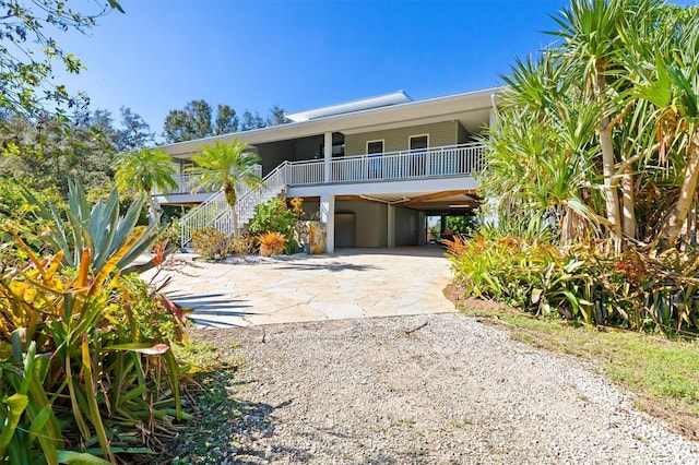 view of front of property featuring a carport