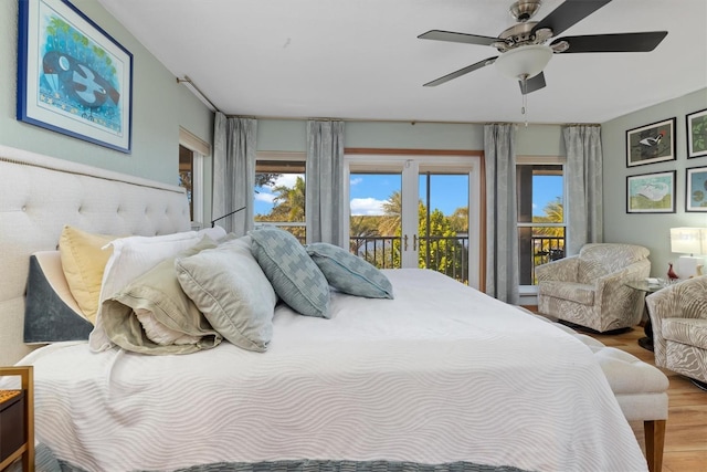 bedroom with access to outside, ceiling fan, light hardwood / wood-style flooring, and french doors