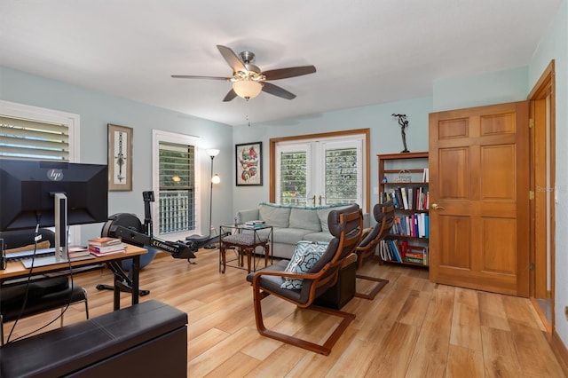 office with french doors, light wood-type flooring, and ceiling fan