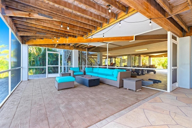 view of pool with a patio and an outdoor living space with a fire pit