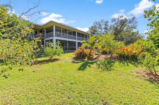 view of yard with a sunroom