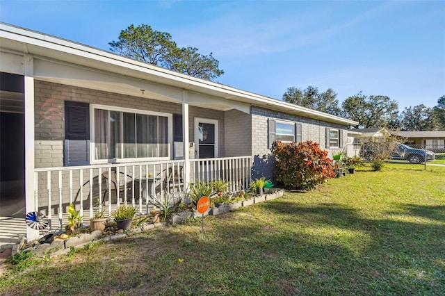 exterior space with a lawn and covered porch