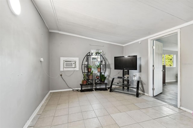 exercise room featuring light tile patterned flooring, a wall mounted air conditioner, baseboards, and ornamental molding